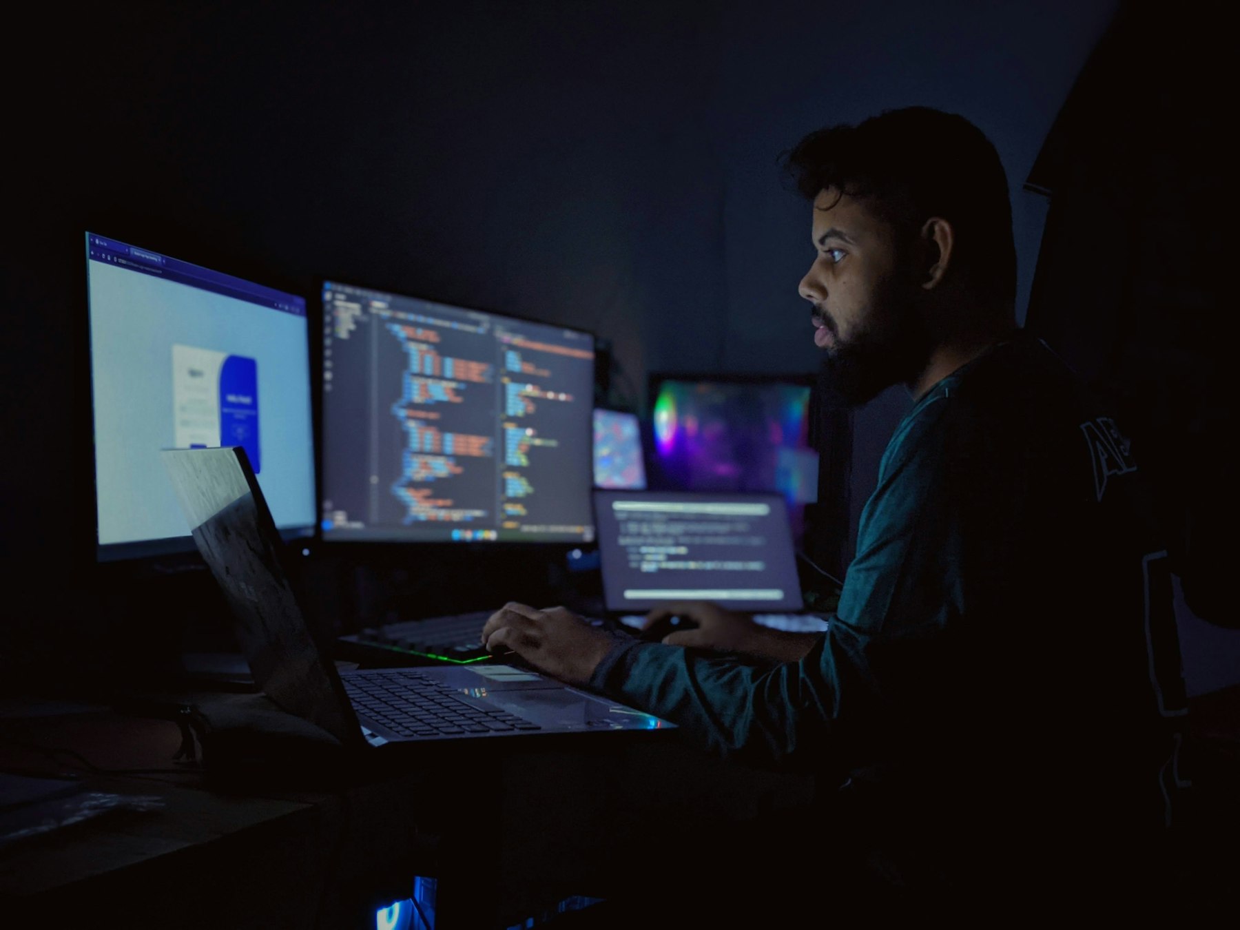 Engineer reviewing a system's architecture across multiple screens